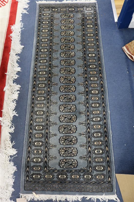 A small blue ground runner, 180cm x 65cm